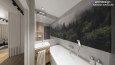 Mała łazienka z akrylową wanną w zabudowie oraz z fototapetą z motywem lasu na ścianie