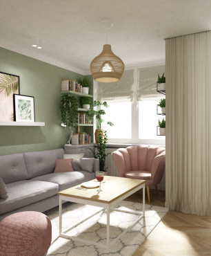 Projekt małego salonu z szarą sofą oraz różowym fotelem