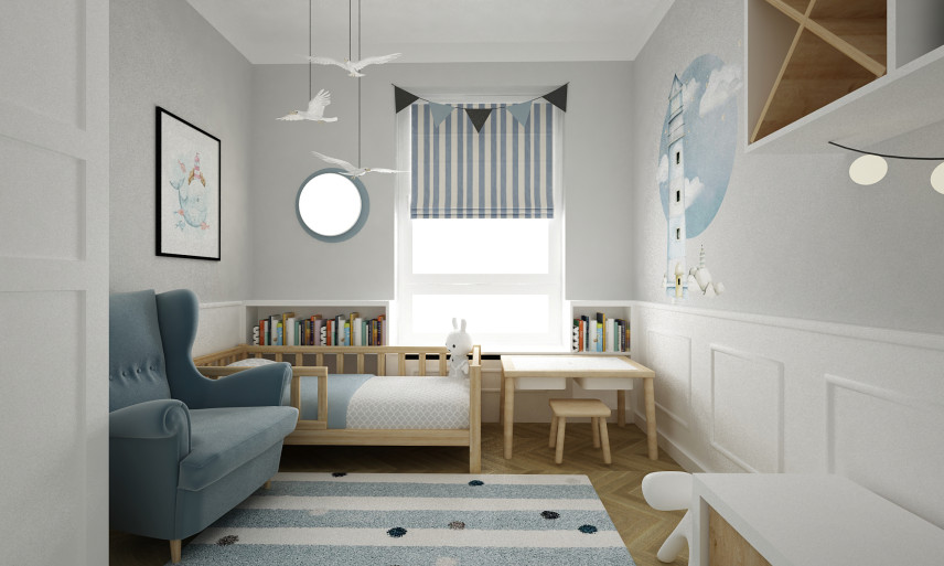 Pokój dziecięcy z fotelem uszak w kolorze niebieskim, łóżkiem, stolikiem oraz szafą