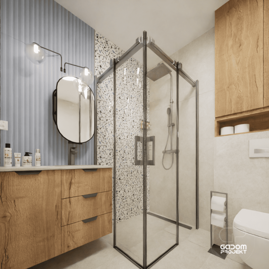 Projekt łazienki ze ścianą lastryko pod prysznicem oraz drewnianą szafką ze zlewem podblatowym