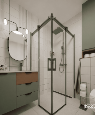 Łazienka z lustrem owalnym oraz prysznicem narożnym