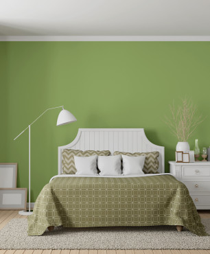 Aranżacja sypialni z zieloną ścianą