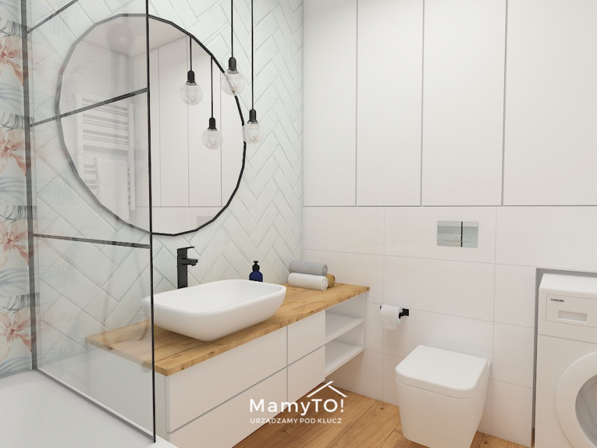 Biała łazienka z okrągłym lustrem
