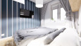 Sypialnia w stylu skandynawskim z telewizorem