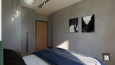 Sypialnia z betonową ścianą