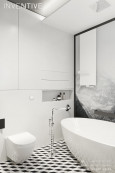 Projekt łazienki z czarno-białą podłogą
