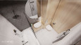Aranżacja łazienki z wanną w zabudowie, lustrem okrągłym