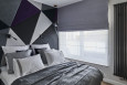 Aranżacja sypialni z tapicerowaną ścianą