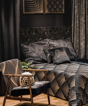 Sypialnia w kolorze czarnym z czarno-złotymi tekstyliami