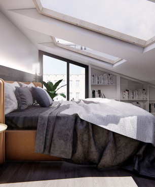 Sypialnia na antresoli z dużymi oknami w suficie
