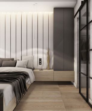 Sypialnia z łóżkiem kontynentalnym i białymi panelami na ścianie