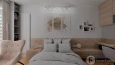 Sypialnia z modnym oświetleniem i obrazem na ścianie