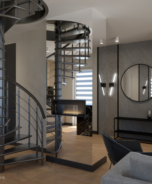 Salon ze schodami okrągłymi prowadzącymi na piętro