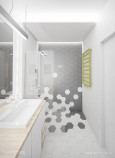 Aranżacja łazienki ze wzorem heksagonalnym pod prysznicem