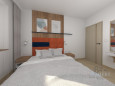 Sypialnia z łóżkiem kontynentalnym z pomarańczowym zagłówkiem