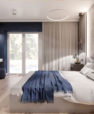 Aranżacja sypialni z łóżkiem kontynentalnym i farbą dekoracyjną na ścianie
