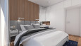 Sypialnia z drewniano-tapicerowaną ścianą