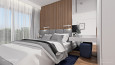 Sypialnia z elementem drewnianym na ścianie z łóżkiem kontynentalnym