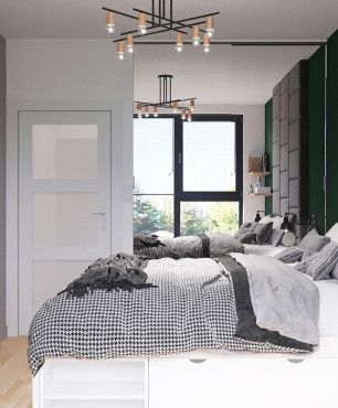 Sypialnia z tapicerowanym kawałkiem ściany za łóżkiem kontynentalnym